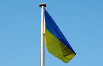 The blue and yellow Ukrainian flag flies above Ƶ House on the Ƶ campus