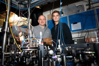 Professor Winfried Hensinger and Dr Sebastian Weidt behind a prototype of a quantum computer in the Ƶ quantum lab