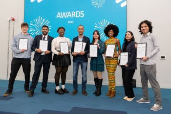 Photograph of all eight finalists of the Startup Ƶ competition, 2024. Each are holding certificates.