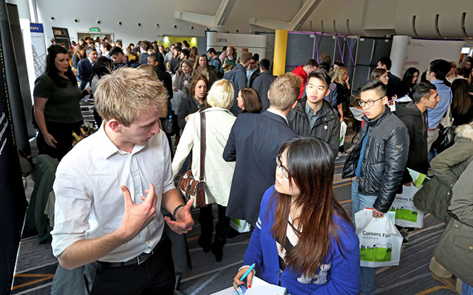 A Ƶ student talking to a potential graduate employer at our annual graduate careers fair