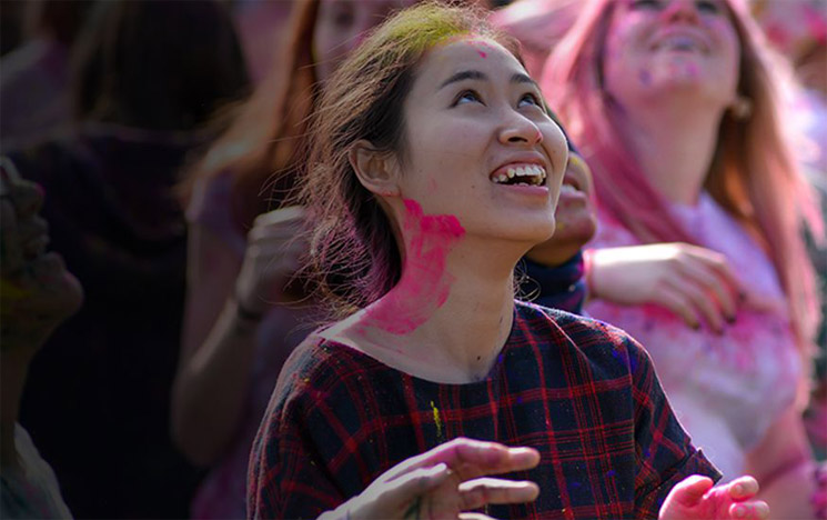 Students celebrate the Holi festival at the Ƶ